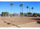 Beach volleyball court with ample sand and seating at 9789 E Cinnabar Ave, Scottsdale, AZ 85258