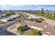 Aerial view showcasing a home's location near a golf course at 9802 N Balboa Dr, Sun City, AZ 85351