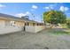 Backyard of the house with an orange tree and partial view of the house at 9802 N Balboa Dr, Sun City, AZ 85351