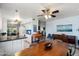 Mid-century modern dining area with wood table and chairs at 9802 N Balboa Dr, Sun City, AZ 85351