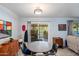 Bright dining area with table and chairs, access to patio at 9802 N Balboa Dr, Sun City, AZ 85351