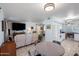 Kitchen with white appliances and dining area at 9802 N Balboa Dr, Sun City, AZ 85351