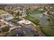 Aerial view of community clubhouse, pool, and parking at 10009 E Michigan Ave, Sun Lakes, AZ 85248