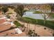 Aerial view of property backing to golf course and lake at 10009 E Michigan Ave, Sun Lakes, AZ 85248