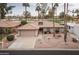 Single-story home with tile roof, attached garage, and desert landscaping at 10009 E Michigan Ave, Sun Lakes, AZ 85248