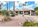 Backyard features a patio, mature landscaping and a golf course view at 10009 E Michigan Ave, Sun Lakes, AZ 85248