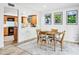 Cozy dining room features a wood table and chairs near the kitchen at 10009 E Michigan Ave, Sun Lakes, AZ 85248