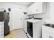 Convenient laundry room with washer, dryer, and extra storage at 10009 E Michigan Ave, Sun Lakes, AZ 85248