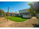 Landscaped backyard with a patio, pool and string lights at 11020 W Lane Ave, Glendale, AZ 85307