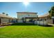 Spacious backyard with grassy lawn, patio, and above-ground pool at 11020 W Lane Ave, Glendale, AZ 85307