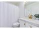 Clean bathroom with a white vanity and gold fixtures at 11020 W Lane Ave, Glendale, AZ 85307