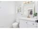 Updated bathroom with white vanity and gold fixtures at 11020 W Lane Ave, Glendale, AZ 85307