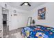 Bedroom with sliding door closet and view into another room at 11020 W Lane Ave, Glendale, AZ 85307