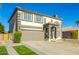 Two-story house with a brown garage door and landscaped yard at 11020 W Lane Ave, Glendale, AZ 85307