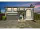 Two-story house with neutral color scheme and landscaped yard at 11020 W Lane Ave, Glendale, AZ 85307