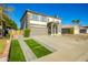 Two-story house with a brown garage door and landscaped yard at 11020 W Lane Ave, Glendale, AZ 85307