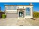 Two-story house with a brown garage door and landscaped yard at 11020 W Lane Ave, Glendale, AZ 85307