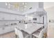 Modern kitchen featuring a large island and white cabinetry at 11020 W Lane Ave, Glendale, AZ 85307