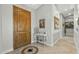 Bright and spacious entry with a wooden door and decorative console table at 1106 E Circle Mountain Rd, New River, AZ 85087