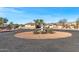 Desert landscape with a large tan home and circular driveway at 1106 E Circle Mountain Rd, New River, AZ 85087