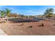 Landscaped front yard with circular driveway and fountain at 1106 E Circle Mountain Rd, New River, AZ 85087