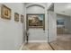 A hallway with artwork and access to other rooms at 1106 E Circle Mountain Rd, New River, AZ 85087