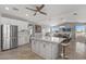 Spacious kitchen with white cabinets, large island, and views to dining area at 1106 E Circle Mountain Rd, New River, AZ 85087