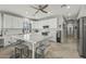 Spacious kitchen featuring white cabinets, an island, and stainless steel appliances at 1106 E Circle Mountain Rd, New River, AZ 85087