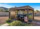 Outdoor bar area with seating and refrigerator at 1106 E Circle Mountain Rd, New River, AZ 85087