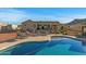 Inviting kidney-shaped pool with lounge chairs at 1106 E Circle Mountain Rd, New River, AZ 85087