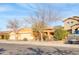 House on a tree-lined street in a residential neighborhood at 11386 W Buchanan St, Avondale, AZ 85323