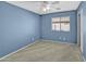 Well-lit bedroom featuring ceiling fan and neutral wall paint at 11386 W Buchanan St, Avondale, AZ 85323