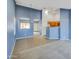 Open concept dining area with kitchen view and blue walls at 11386 W Buchanan St, Avondale, AZ 85323