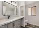 Modern bathroom with updated vanity, new flooring, and large mirror at 11596 W Sierra Dawn Blvd # 109, Surprise, AZ 85378