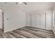 Bright bedroom with vinyl plank flooring and large closet at 11596 W Sierra Dawn Blvd # 109, Surprise, AZ 85378