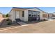 Mobile home with carport and nicely landscaped front yard at 11596 W Sierra Dawn Blvd # 109, Surprise, AZ 85378