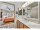 Bathroom with marble vanity and view into bedroom at 12050 N Panorama Dr # 208, Fountain Hills, AZ 85268