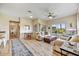 Bright living room with light colored sofas and hardwood floors at 12050 N Panorama Dr # 208, Fountain Hills, AZ 85268