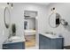 Spa-like bathroom with double vanity, marble countertops, and views into bedroom at 1233 E Monte Vista Rd, Phoenix, AZ 85006