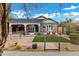 Charming brick home with a well-manicured lawn and modern metal fence at 1233 E Monte Vista Rd, Phoenix, AZ 85006