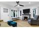 Living room with hardwood floors, fireplace, and ample natural light at 1233 E Monte Vista Rd, Phoenix, AZ 85006