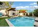 Inviting pool with multiple umbrellas at 1233 E Monte Vista Rd, Phoenix, AZ 85006