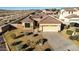 Single-story house with tile roof, driveway, and landscaped yard at 1306 E Cecil Ct, Casa Grande, AZ 85122