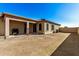 Spacious backyard with covered patio and grassy area at 1306 E Cecil Ct, Casa Grande, AZ 85122