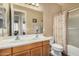 Double sink bathroom with shower/tub combo and updated vanity at 1306 E Cecil Ct, Casa Grande, AZ 85122