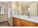 Bathroom with double sinks and a large mirror at 1306 E Cecil Ct, Casa Grande, AZ 85122