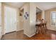 Inviting entryway with tile flooring, a view of the kitchen, and hardwood floors at 1306 E Cecil Ct, Casa Grande, AZ 85122