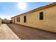 Exterior view of the home showcasing stucco siding and window details at 1306 E Cecil Ct, Casa Grande, AZ 85122