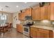 Eat-in kitchen with granite countertops and wood cabinets at 1306 E Cecil Ct, Casa Grande, AZ 85122