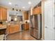 Kitchen with stainless steel appliances and wood cabinets at 1306 E Cecil Ct, Casa Grande, AZ 85122